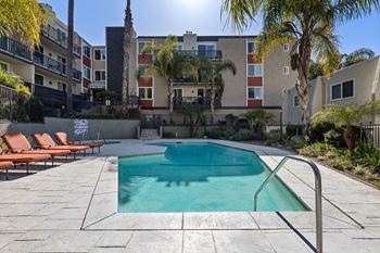 Pool With Lounge Chairs at Parkway Plaza Apartments, Culver City, CA
